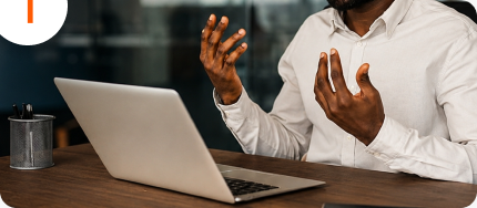 Business planning conversation beside a laptop